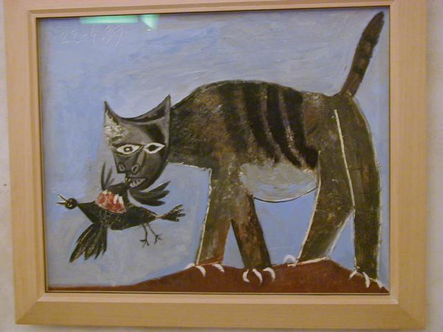 Picasso cat eats a bird